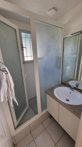 a bathroom with a sink and a shower at VVF Sigean Port-la-Nouvelle Corbières in Sigean