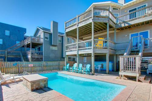 a apartment building with a swimming pool and a balcony at 5725 - A Dream Vacation in Nags Head