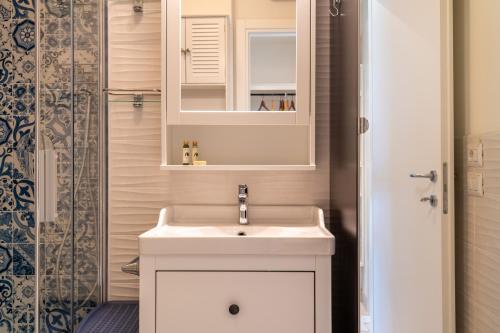a bathroom with a white sink and a shower at Casa Concetta in Rapallo