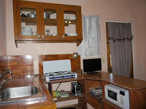 TV a/nebo společenská místnost v ubytování Ellen Bay Cottages