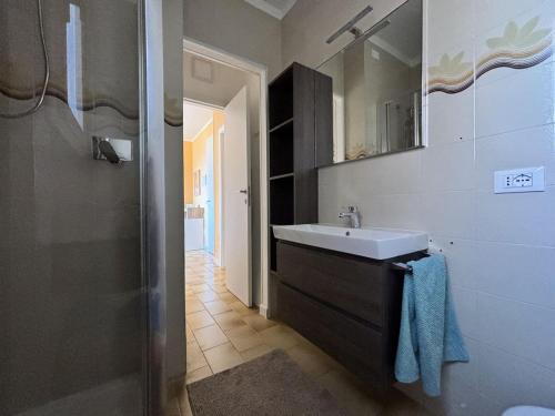 a bathroom with a sink and a mirror at Capo d 'Arco - Agrumeto in Capo D'Arco