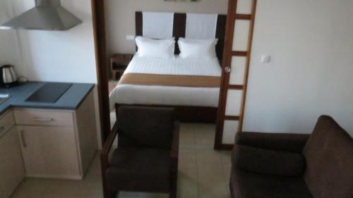 Postel nebo postele na pokoji v ubytování Plumeria Hotel
