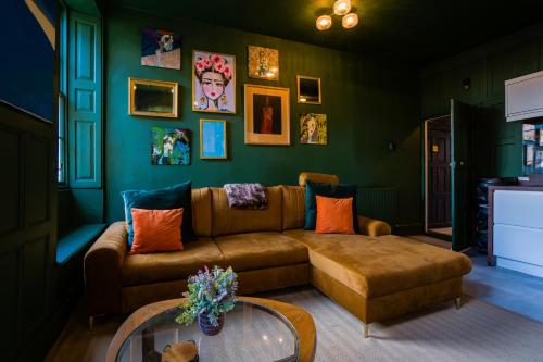 a living room with a couch and a table at The Old House Apartment in Shrewsbury