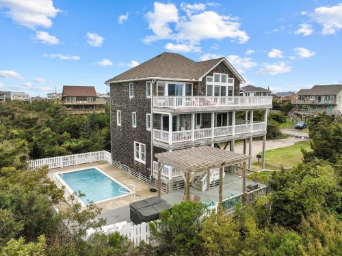 an aerial view of a house with a swimming pool at 7219 - C-Waves in Salvo