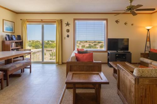 a living room with a couch and a tv at 7504 - Sunrise-Sunset in Avon