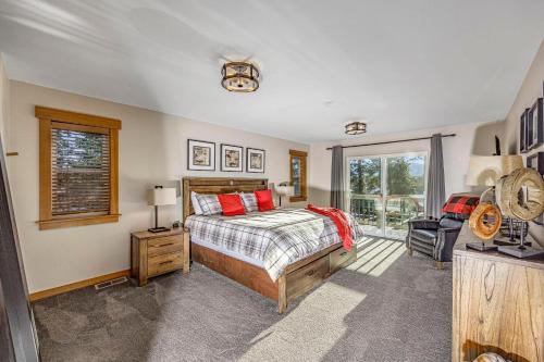 a bedroom with a bed and a window at Coal Chute Lodge in Ronald