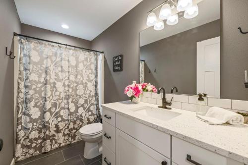 a bathroom with a sink and a toilet and a mirror at Crimson Cabin in Ronald