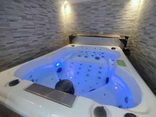 a jacuzzi tub in a room at Le Spa des Laurières in Bagnères-de-Bigorre