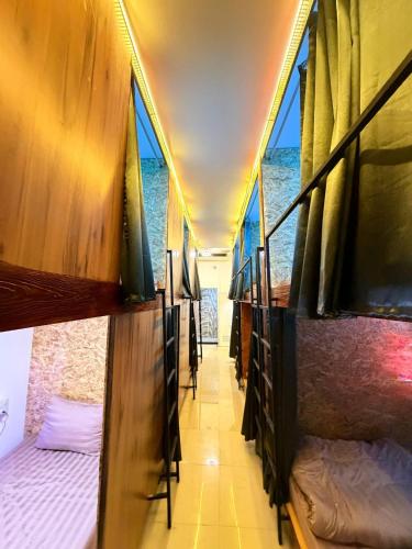 a corridor of a room with beds and the ocean at Asia Mahanakhorn Travel in Bangkok