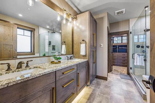 a bathroom with a double sink and a shower at Suncadia Dreamin Lodge in Cle Elum