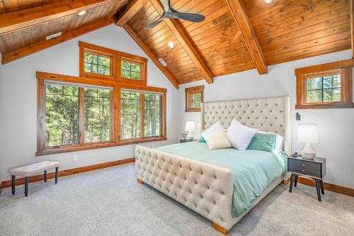 a bedroom with a large bed in a room with wooden ceilings at Suncadia Craftsman in Cle Elum