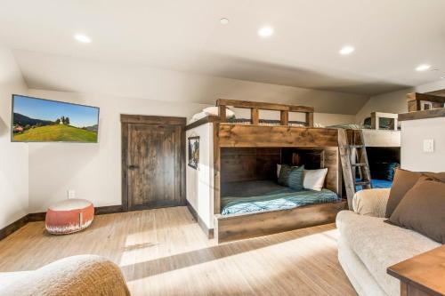 a living room with a bunk bed and a couch at Idol Pines in Cle Elum