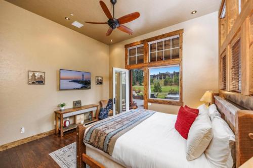 a bedroom with a bed and a ceiling fan at Tin Cup in Cle Elum