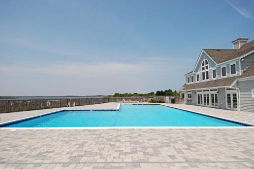 a swimming pool in front of a house at 2408 - Herring Gull in Duck