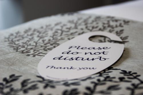 a note that has been placed on a piece of cloth at The Maple Manor Hotel in Crawley