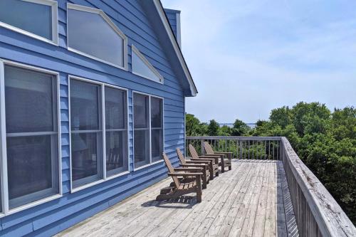 a group of benches sitting on the deck of a house at 3213 - Seaside Salvation in Duck