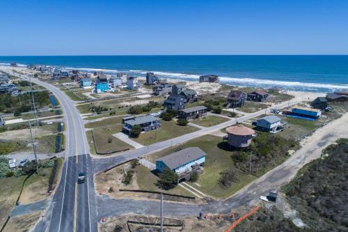 an aerial view of a city and the ocean at 7022 - East Point El Dorado in Rodanthe
