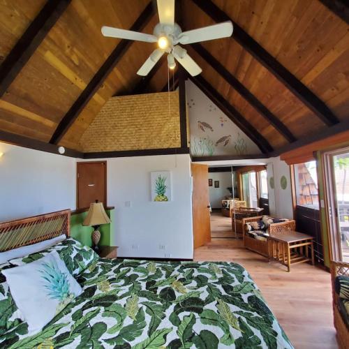 a bedroom with a bed and a ceiling fan at 58 2 bedroom 2 bath in Pahala