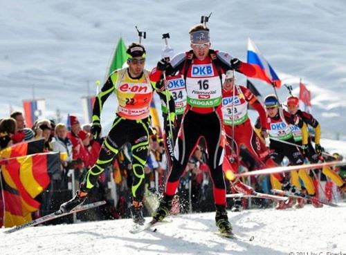 a group of men skiing down a snow covered slope at Appartementhaus Charisma in Fieberbrunn