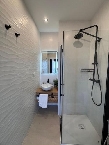 a bathroom with a shower and a sink at LUSAIL 1ª línea playa ADULTS ONLY in Vinarós