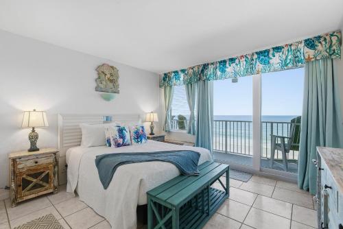 a bedroom with a bed and a view of the ocean at Daytona Beach in Daytona Beach