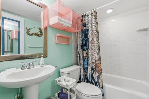 a bathroom with a sink and a toilet at Daytona Beach in Daytona Beach