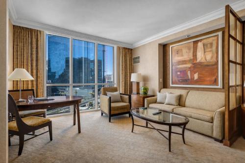 a living room with a couch and a table at MGM Signature Tower 2 8th Floor 2-Suite Strip View Balcony No Resort Fee in Las Vegas