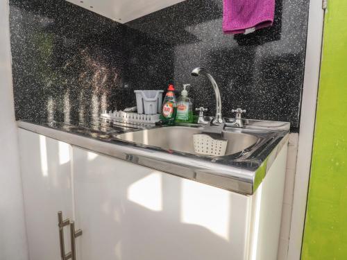 a sink in a bathroom with a counter top at Number 3 in Blackpool