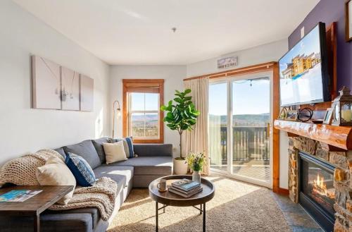 a living room with a couch and a fireplace at HH207 Ski-inSki-out Condo Hot Tub Sleeps 4 in Snowshoe