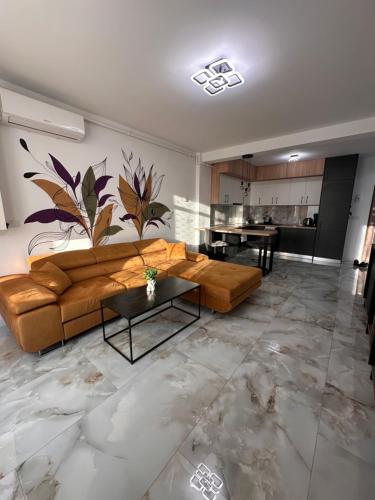 a living room with a couch and a table at Apartament Urban Chic in Sebeş