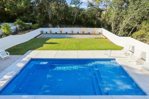 a swimming pool in the backyard of a house at 4920 - Stress Less II in Kitty Hawk