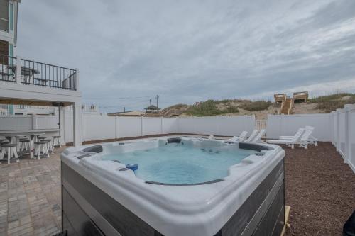 a hot tub sitting on top of a patio at 5705 - Edgewater View in Nags Head
