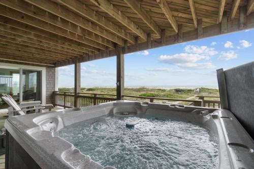 a hot tub on the deck of a house at 7865 - Peridot in Frisco