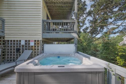 a hot tub on the back of a house at 4603 - Yellow Brick Road in Southern Shores