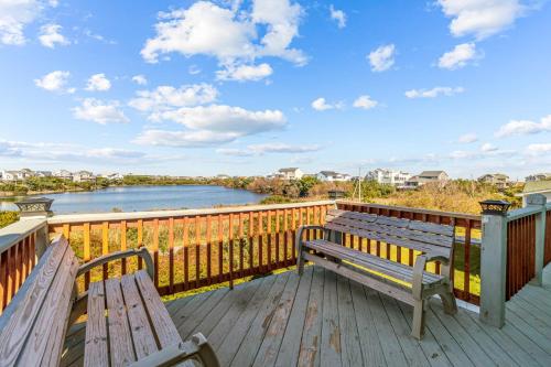two benches on a deck with a view of a river at 7200 - Better Surf Than Sorry in Salvo