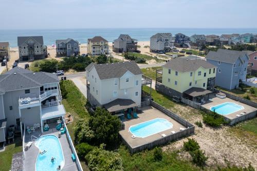 an aerial view of a home with a swimming pool at 7676 - Nautical by Nature in Avon