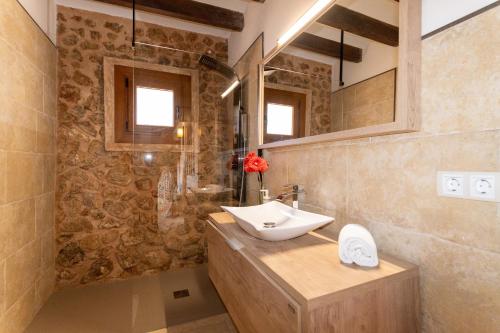 a bathroom with a sink and a mirror at Villa My Love Mallorca in Bunyola