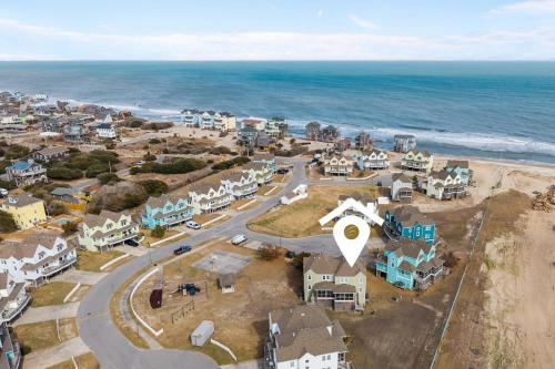 an aerial view of a small town next to the ocean at 7766 - Striper in Buxton