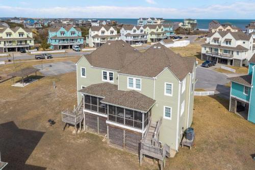 an aerial view of a house in a residential neighborhood at 7767 - Swordfish in Buxton