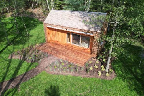 an overhead view of a tiny house in a yard at Architectural Cabin 18 mins to Catamount in Taghkanic