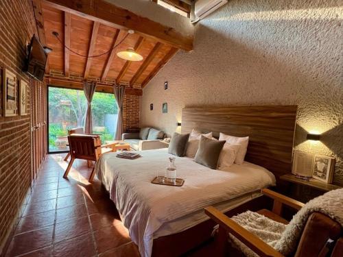 a bedroom with a large bed in a room at Orgánico Hotel Boutique TEPOZTLÁN in Tepoztlán