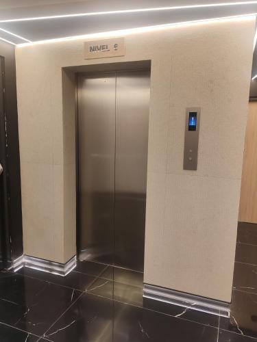 an elevator in a building with a metal door at STREET MALL Luna N6-3 in Puebla