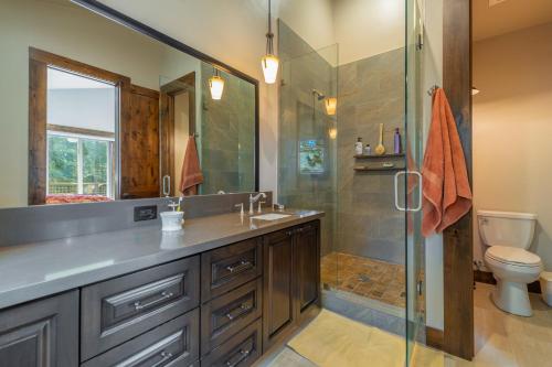 a bathroom with a sink and a shower at 4BR Home w/ 2 Decks, Near Lake & Ski Resorts in Truckee