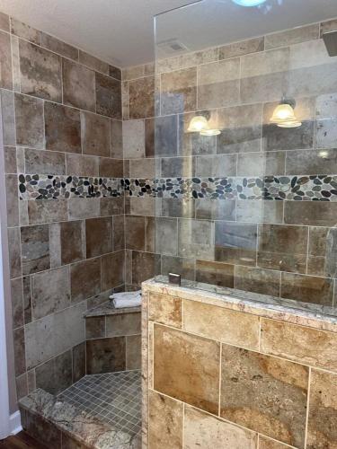a bathroom with a large shower with a tub at Mountain View Condo 3702 in Pigeon Forge