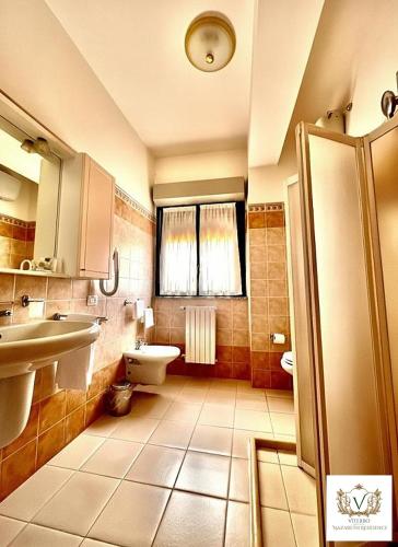 a bathroom with a sink and a toilet at Nazareth Residence in Viterbo