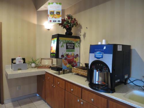 a coffee machine sitting on a counter in a room at Country Inn Ontario in Ontario