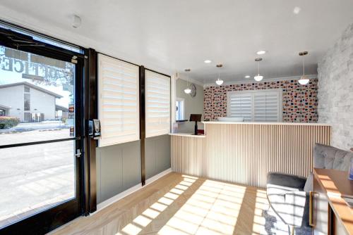a kitchen with a counter and a window at Signature Inn Medford Downtown - Newly Renovated in Medford