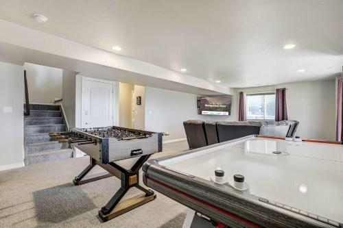 a living room with a pool table and a ping pong table at Rangeview Pass Pet Friendly with Epic Peak Views in Monument