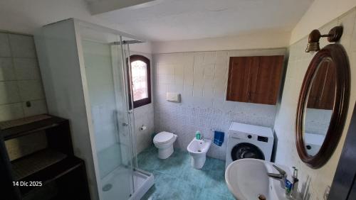 a bathroom with a sink and a toilet and a shower at Casa Sofia in Torre delle Stelle