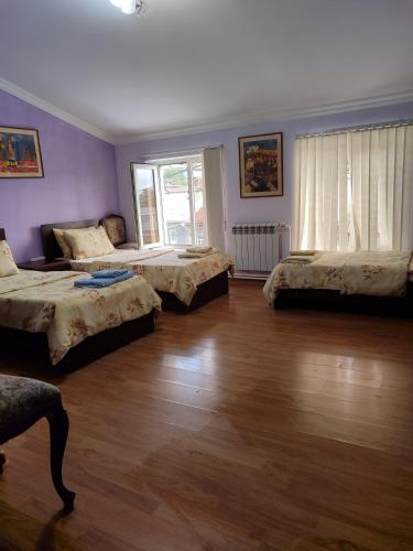 Llit o llits en una habitació de BONJOUR HOUSE